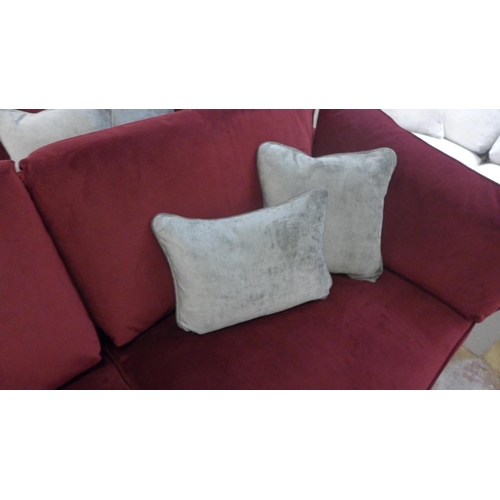 1330 - A Barker and Stonehouse mulberry velvet upholstered four seater sofa RRP £1699