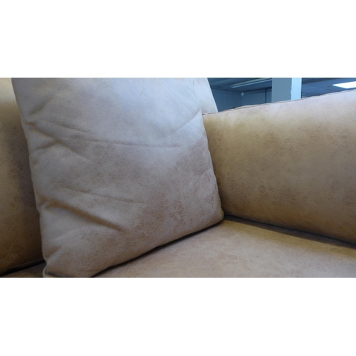 1349 - A vegan tan leather upholstered three seater sofa (some minor marks)