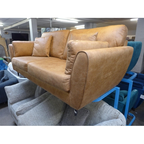 1349 - A vegan tan leather upholstered three seater sofa (some minor marks)