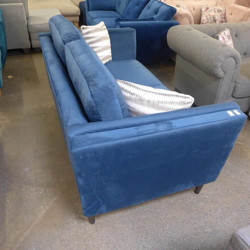 1354 - A navy blue upholstered two seater sofa with patterned scatter cushions