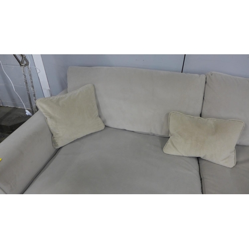 1360 - A Sandstone upholstered left hand facing corner sofa/chaise - marked