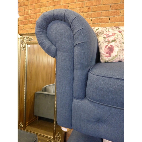 1526 - A pair of blue textured weave upholstered Chesterfield sofas with patterned scatter cushions