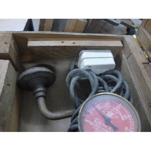 2031 - A wooden box with hand drill and plug actelyne regulator