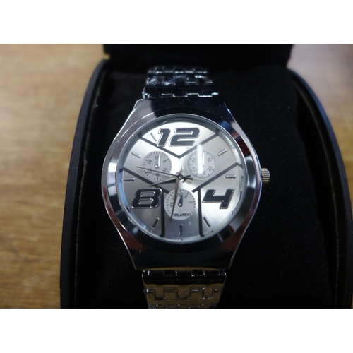 2126 - A two-tone chronograph style men's wristwatch and a silver coloured chronograph style wristwatch