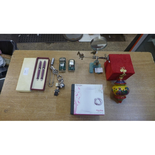 2137 - A magnifying glass on stand with crocodile clips, a selection of key fobs and chains including Lego ... 