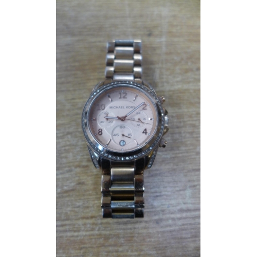 2150 - A Michael Kors pink faced wristwatch