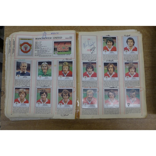 2155 - A box of  figurine panini Football 80 football sticker book- mostly complete and signed by players  ... 