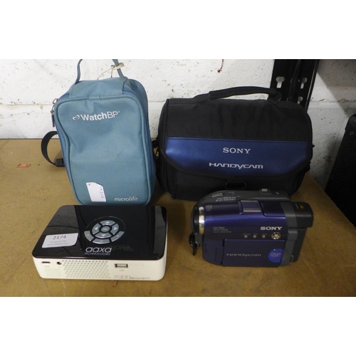 2174 - An Aaza Technologies P300 micro projector in carry case and a Sony digital video camera, model:- DCR... 