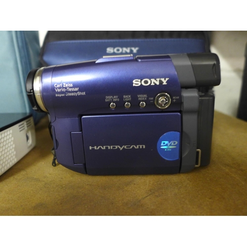 2174 - An Aaza Technologies P300 micro projector in carry case and a Sony digital video camera, model:- DCR... 