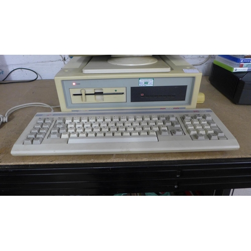 2177 - An Amstrad PC-CM, Amstrad PC1512DD, Amstrad PC1512 keyboard, boot discs and mouse