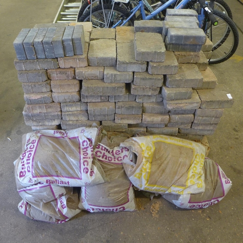 2224 - A pallet of paving blocks:- small, medium and large tegula blocks and 5 bags of builders sand