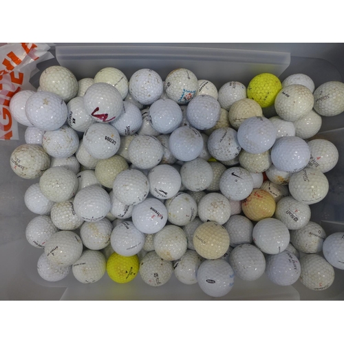 2228 - 3 golf bags with quantity of woods, irons and golf trolley with a tub of Approx. 150 golf balls