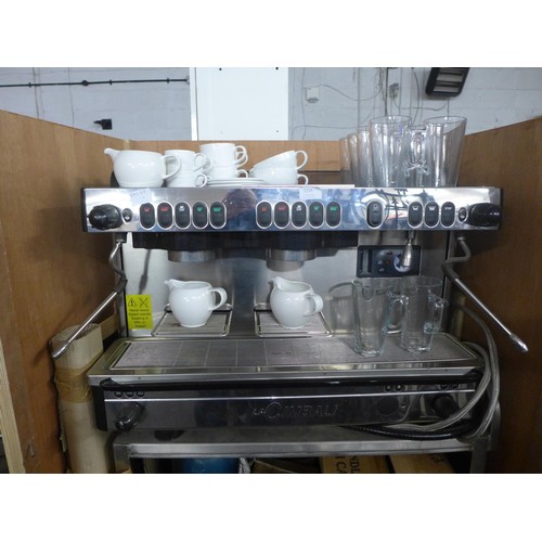 2215 - A La Cimbali M29-Selectron coffee machine complete with cups, saucers, latte glasses and a metal sta... 