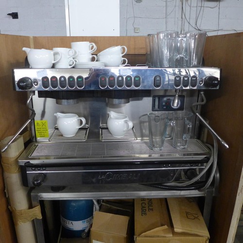 2215 - A La Cimbali M29-Selectron coffee machine complete with cups, saucers, latte glasses and a metal sta... 