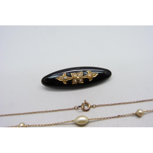 1020 - A Victorian mourning brooch set with seed pearls and a fine 9ct gold and pearl necklace, (very small... 