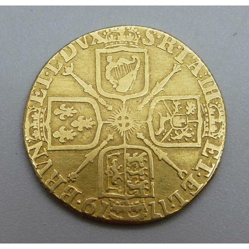 1022 - A George I 1719 gold guinea, worn, edge re-milled, 7.1g,