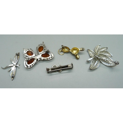 1041 - A silver, amber set butterfly brooch and four other silver brooches