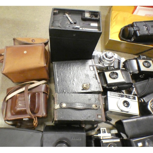 1084 - A box of vintage cameras **PLEASE NOTE THIS LOT IS NOT ELIGIBLE FOR POSTING AND PACKING**