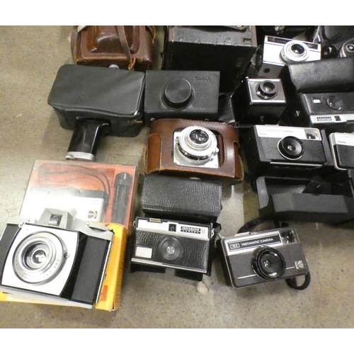 1084 - A box of vintage cameras **PLEASE NOTE THIS LOT IS NOT ELIGIBLE FOR POSTING AND PACKING**