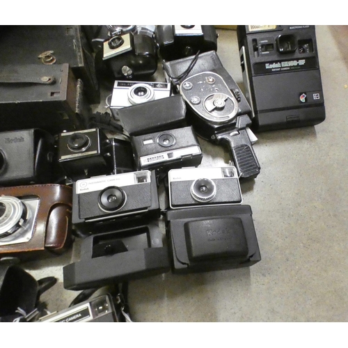 1084 - A box of vintage cameras **PLEASE NOTE THIS LOT IS NOT ELIGIBLE FOR POSTING AND PACKING**