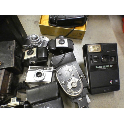 1084 - A box of vintage cameras **PLEASE NOTE THIS LOT IS NOT ELIGIBLE FOR POSTING AND PACKING**