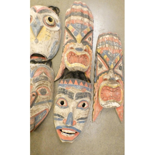 1088 - A collection of carved tribal masks **PLEASE NOTE THIS LOT IS NOT ELIGIBLE FOR POSTING AND PACKING**