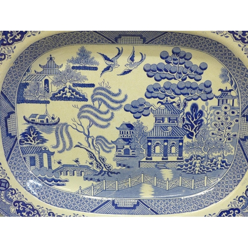 612 - A 19th Century blue and white Willow pattern serving plate, 46cm