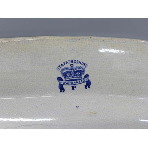 612 - A 19th Century blue and white Willow pattern serving plate, 46cm