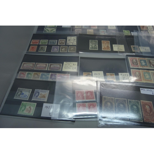 623 - Stamps; better stamps and sets on 32 stockcards, all identified and catalogued at over £1,500