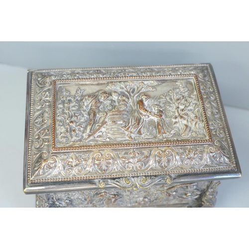 643 - A plate on copper embossed jewellery casket, 14.5cm width