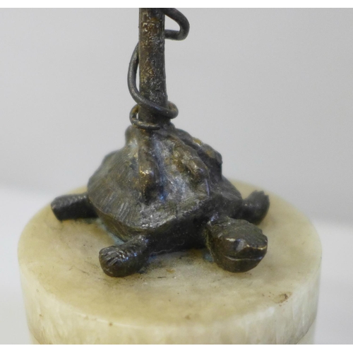 656 - A bronze model of a bird standing on a turtle, on a quartz base