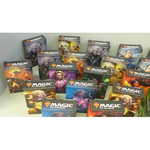 665 - Thirty four boxes of Magic The Gathering cards and a collection of loose cards