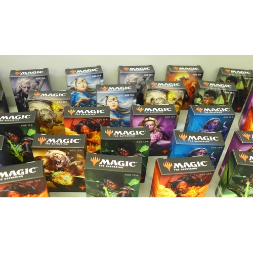 665 - Thirty four boxes of Magic The Gathering cards and a collection of loose cards