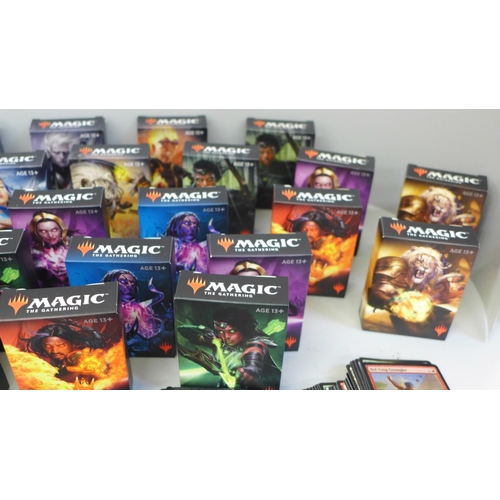 665 - Thirty four boxes of Magic The Gathering cards and a collection of loose cards