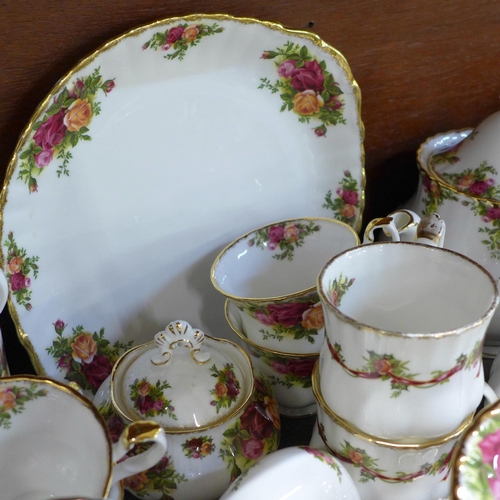 668 - A collection of Royal Albert Old Country Roses including a cake stand, fourteen side plates, six bow... 