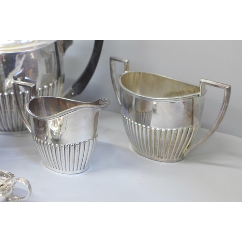 675 - A Walker & Hall silver plated four piece tea service and other silver plated ware