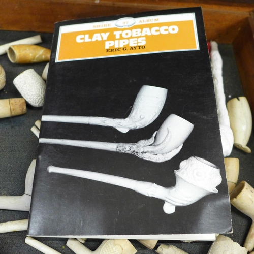 695 - A box of clay pipes