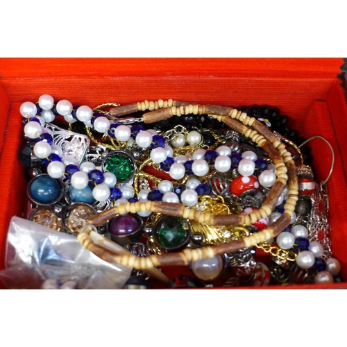 699 - A casket of costume jewellery and four boxed necklaces