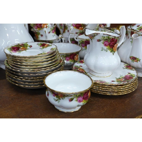 702 - A Royal Albert Old Country Roses coffee and tea service, one coffee cup, tea cup and cream jug a/f, ... 