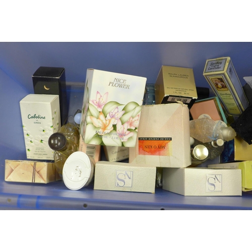 711 - A box containing used perfumes including Chanel No 5