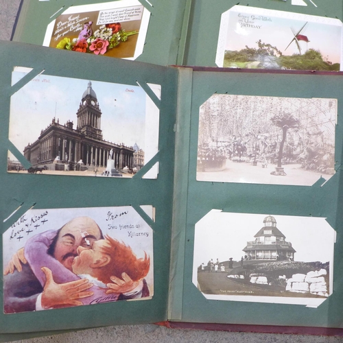 731 - A box of assorted Edwardian postcards and two albums