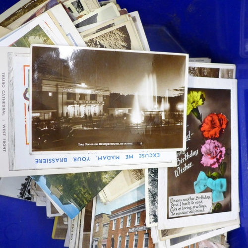 731 - A box of assorted Edwardian postcards and two albums