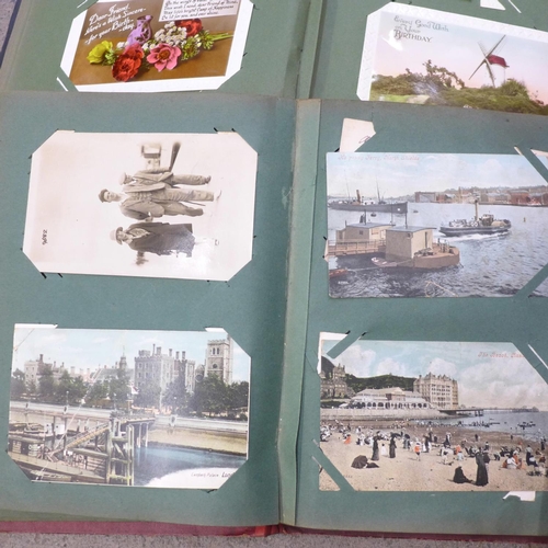 731 - A box of assorted Edwardian postcards and two albums