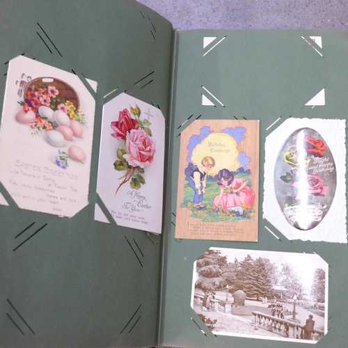 731 - A box of assorted Edwardian postcards and two albums