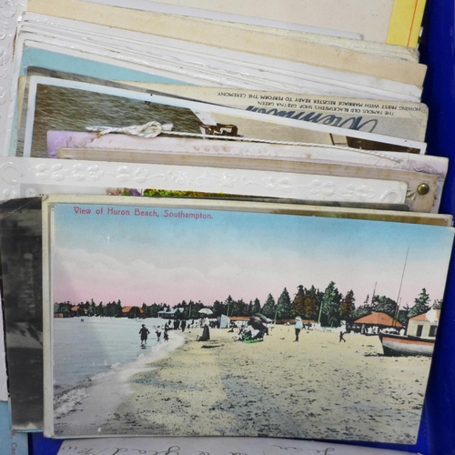 731 - A box of assorted Edwardian postcards and two albums