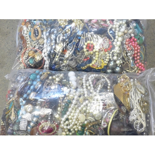 735 - Two large bags of costume jewellery