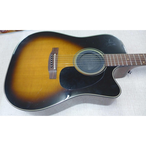 767 - A Takamine electro-acoustic guitar, EF340SC TBS, with a hard case and CT-4BII active pre-amp