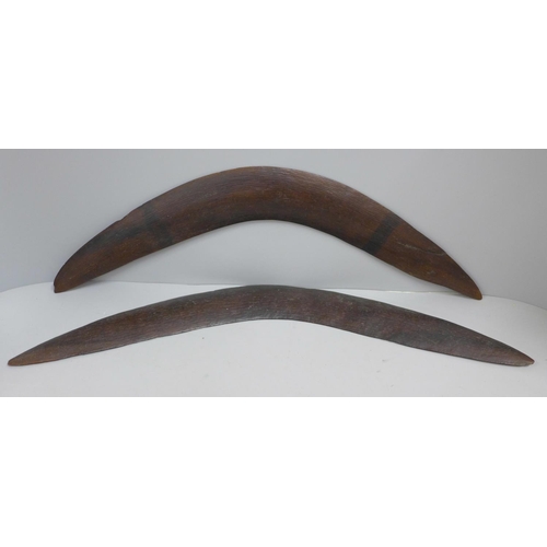 824 - Two carved wooden boomerangs, one a/f