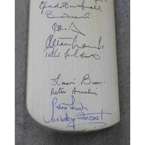 826 - An England cricket bat, signed by Mike Gatting, Gladstone Small, David Gower, Allan Lamb, Bruce Fren... 