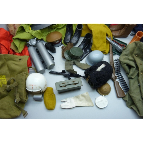 828 - A collection of Action Man 1960s clothes and accessories including rifle rack, helmets, guns, dinghy... 